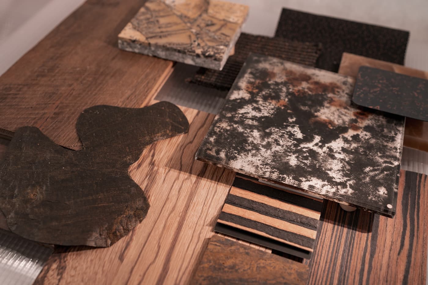 Flatlay of wood, stone and metal material samples