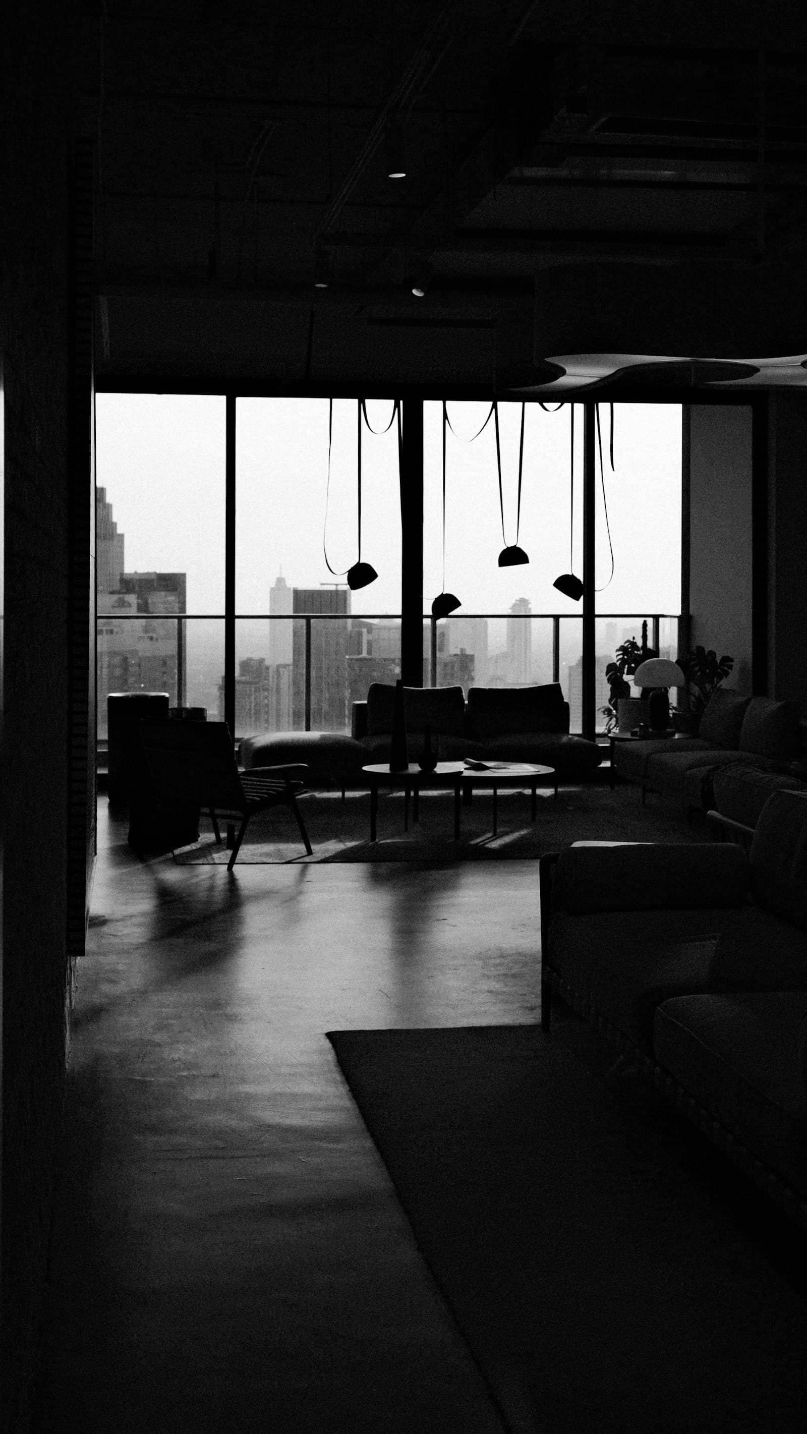 Luxury residence lounge with panoramic city view at dusk